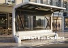Futuristic Smart Bus Shelter with Glass Panels and LED Lighting